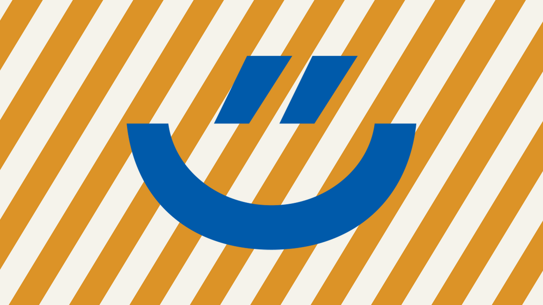 Blauer Smily auf orange, gestreiftem Hintergrund (Visual des Ehrentages)