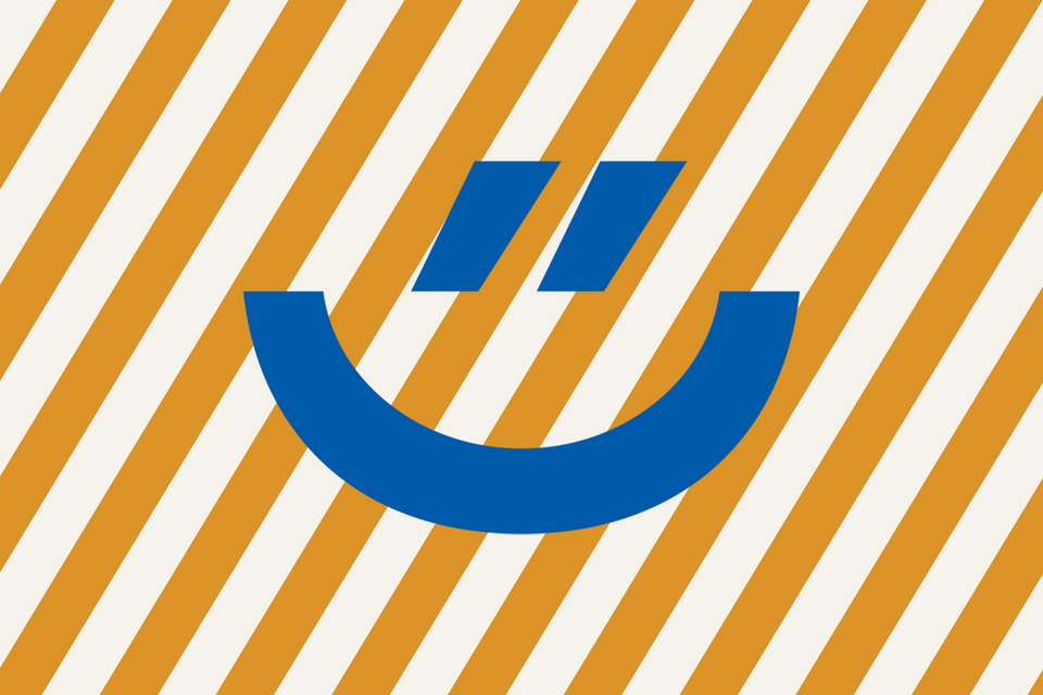 Blauer Smily auf orange, gestreiftem Hintergrund (Visual des Ehrentages)